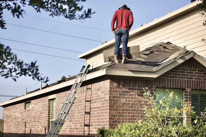 Professional roofer working on a residential roof in North Beach